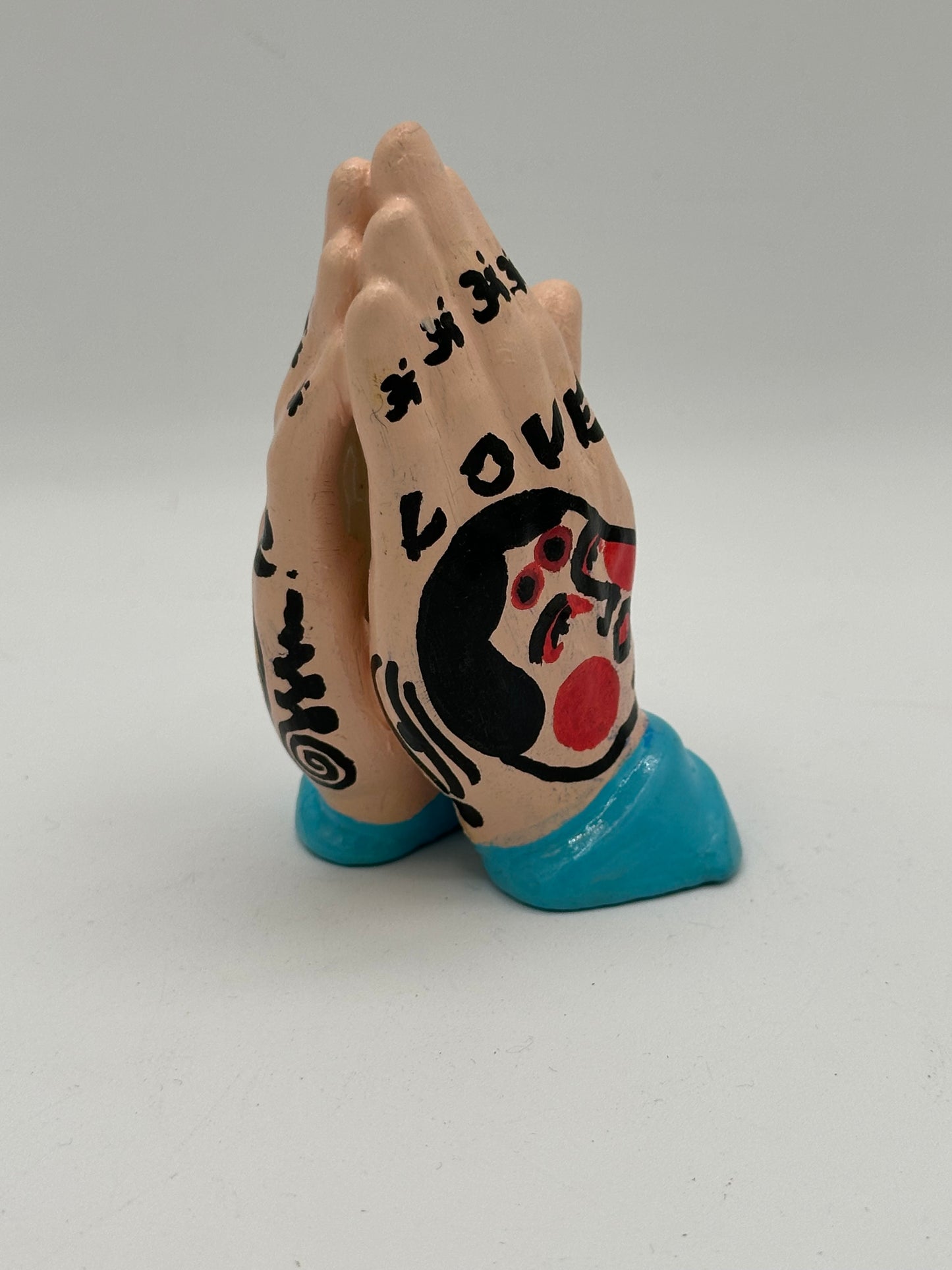 Praying hands (blue)